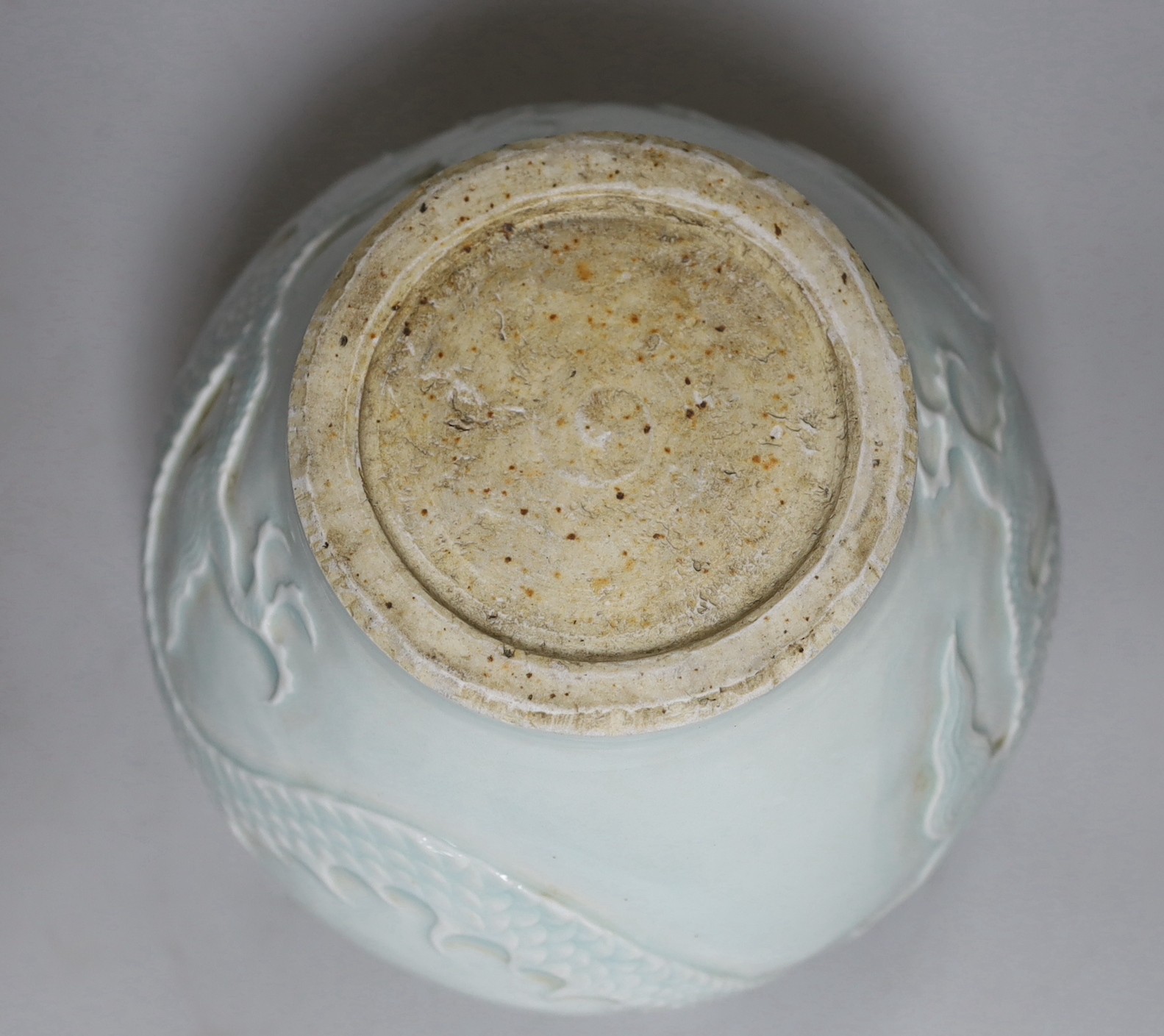 A Chinese relief moulded ‘dragon’ vase, 17cms
